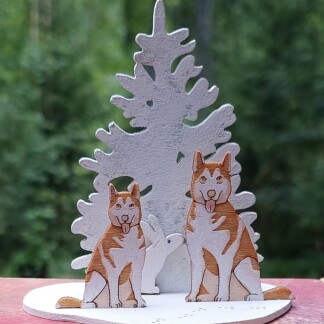 Huskyt ja pupu kuusi